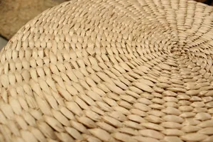 Close-up view of natural straw woven texture, durable and eco-friendly cushion detail.