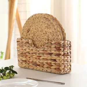 Natural woven placemat set detail view, straw storage basket for rustic kitchen table decor.