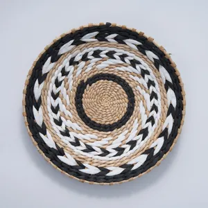 Handcrafted woven wall hanging featuring geometric black white patterns bohemian chic decor detail