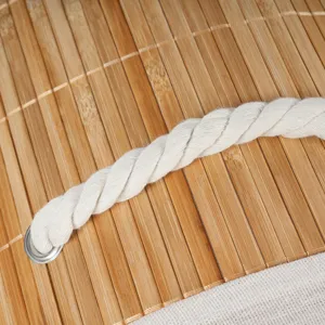 Bamboo storage basket detail, white rope handle, natural weave texture, durable home organizer.