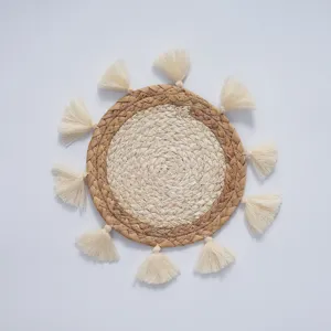Bohemian round cattail woven wall hanging with white fringe details, intricate handicraft.