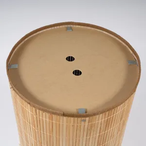 Detailed top view of a natural bamboo woven storage basket with sturdy structure and breathable base.