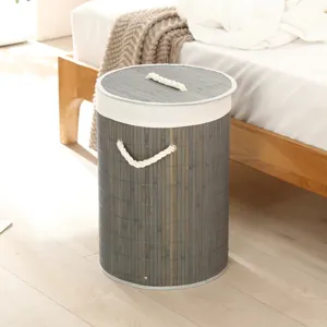 Panier à linge en bambou avec couvercle et poignées en corde pour chambre et rangement.
