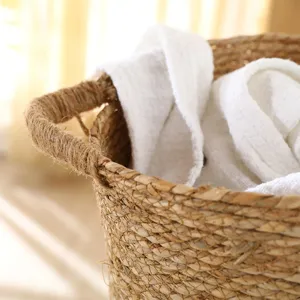Handmade seagrass storage basket detail showing natural woven texture and durable handles.