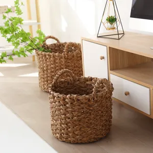 Handmade straw woven flower pot and storage basket with handles for pastoral home decor and plants.