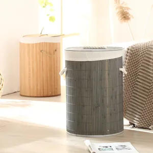 Panier à linge rond en bambou pour le rangement avec couvercle et doublure en tissu.