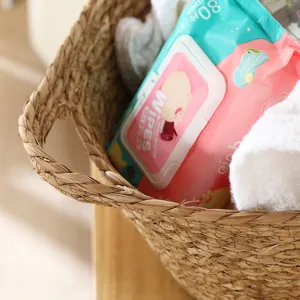 Handmade seagrass storage basket woven laundry hamper for clothes sorting and home organization.