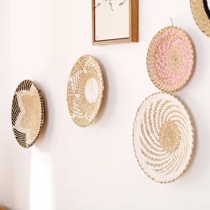 Minimalist woven wall basket detail, natural straw art decor for cozy living room interior.