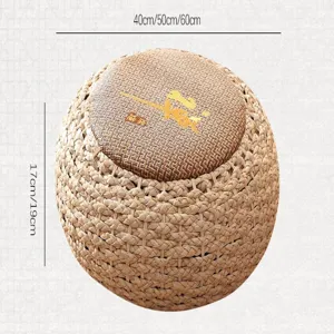Close-up of handmade woven straw pouf cushion showing fine texture and natural braided design.