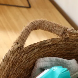 Close-up detail of handmade seagrass woven storage basket handle with natural rope wrapping.