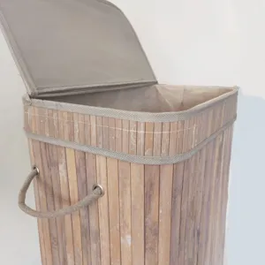 Detail view of bamboo woven laundry basket with lid and rope handles for home organization.