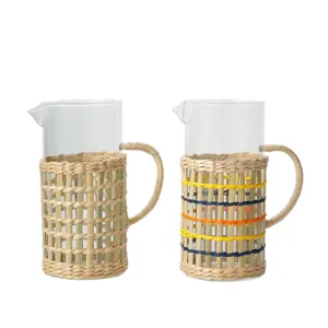 Handcrafted glass pitcher with woven straw sleeve, rustic style water jug for home and bar.