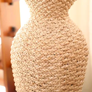 Close-up detail of natural woven rattan vase texture, perfect for dry flower decor displays.