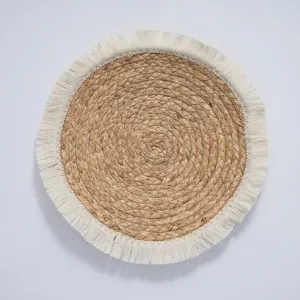 Handmade woven round placemat, natural straw water hyacinth table mat with white fringe.