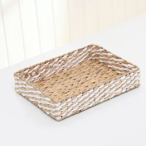 Detailed view of the woven storage basket, showing close-up straw and white rope texture.