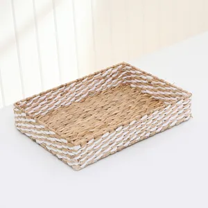 Woven storage basket detail showing natural straw and white braid texture for home organizing.