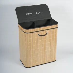 Close-up view of dual compartment bamboo laundry hamper with sorting text on the inner lid.