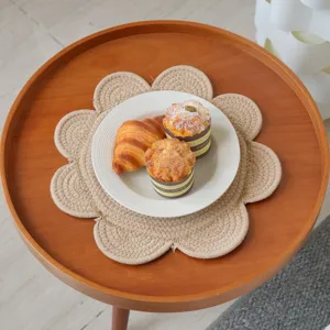 Detailed view of a Nordic cotton rope woven placemat with flower shape, heat insulation pad.