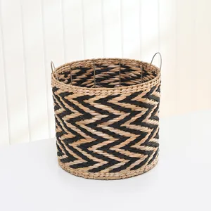 Woven storage basket detail, black and white pattern, natural straw material for home.