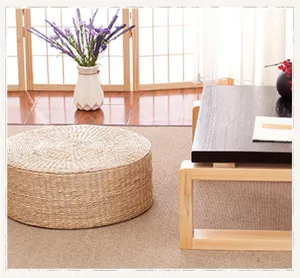 Woven straw tatami meditation cushion detail, natural fiber texture for home zen decor.