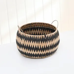 Round straw woven storage basket with iron handle black white chevron pattern for home tidy.