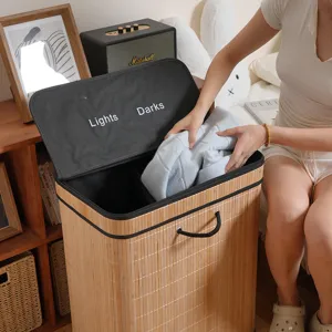 Detailed view of bamboo laundry hamper with dual compartments and Lights Darks labels.
