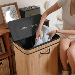 Nordic bamboo laundry hamper with dual compartments and lid for bedroom home organization.