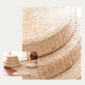 Round straw woven meditation cushion tatami floor mat for Zen yoga and home decor use.