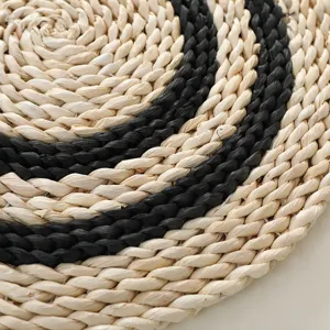 Handmade straw woven placemat corn husk heat insulation pad round table mat detail.