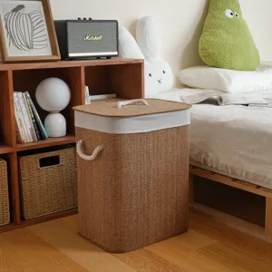 Cozy bedroom scene featuring a durable bamboo woven laundry hamper with handles and a lid.