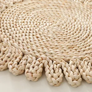 Handcrafted corn husk woven placemat, rustic heat insulation pad for dining table and tea cups.
