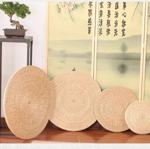 Handmade straw woven round meditation cushion tatami floor mat for yoga and zen tea room.