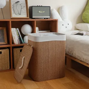 Handmade bamboo woven laundry hamper with lid and fabric liner for bedroom home storage.