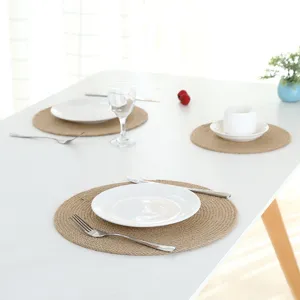Detailed close-up view of the natural woven jute placemat on dining table setup.