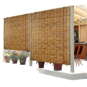 Natural reed roller blind for outdoor patio garden shading and privacy sun protection.