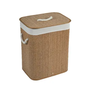 Handmade woven laundry basket with lid and rope handles for home storage and organization.