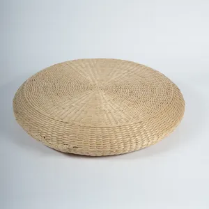 Round natural corn husk meditation cushion detail showing woven texture for tatami yoga seating.