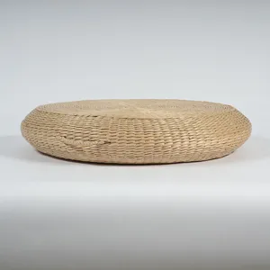 Handmade round corn husk meditation cushion, natural woven tatami yoga mat for home floor seating.