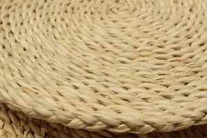 Close-up detail of natural woven straw corn husk tatami mat texture showing craftsmanship.