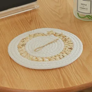 Round straw braided placemat heat resistant table mat detail shot natural material