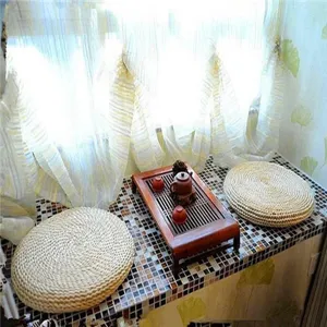 Handcrafted straw cushion detail showcasing natural corn husk texture and eco friendly design.