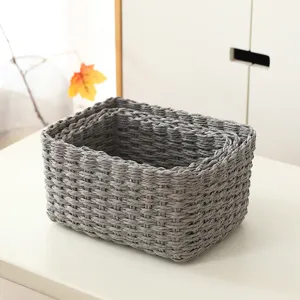 Grey woven storage basket set for desktop and cosmetic organization, elegant home detail.
