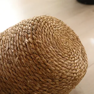 Handcrafted straw woven laundry basket detail shot, natural plant fiber texture for home storage.
