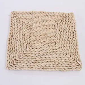 Natural corn husk woven square heat resistant table mat for dining room kitchen decor.