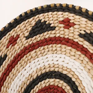 Detailed close-up of a Japanese style woven wall hanging mat with geometric straw patterns.