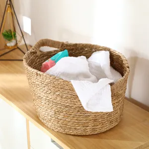 Handmade woven seagrass storage basket detail showing natural texture and sturdy double handles.