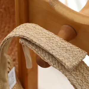 Detailed view of handmade straw woven sun visor cap, showing exquisite natural texture.