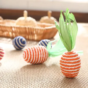 Handwoven straw carrot and ball ornaments, natural fiber desktop decor and pet toys.