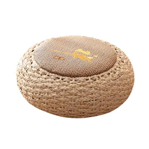 Round straw woven meditation pouf cushion tatami floor seat for home and balcony use.