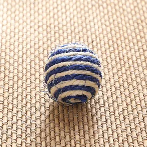 Detailed close-up view of blue and white woven rope ball showing textured craft design.